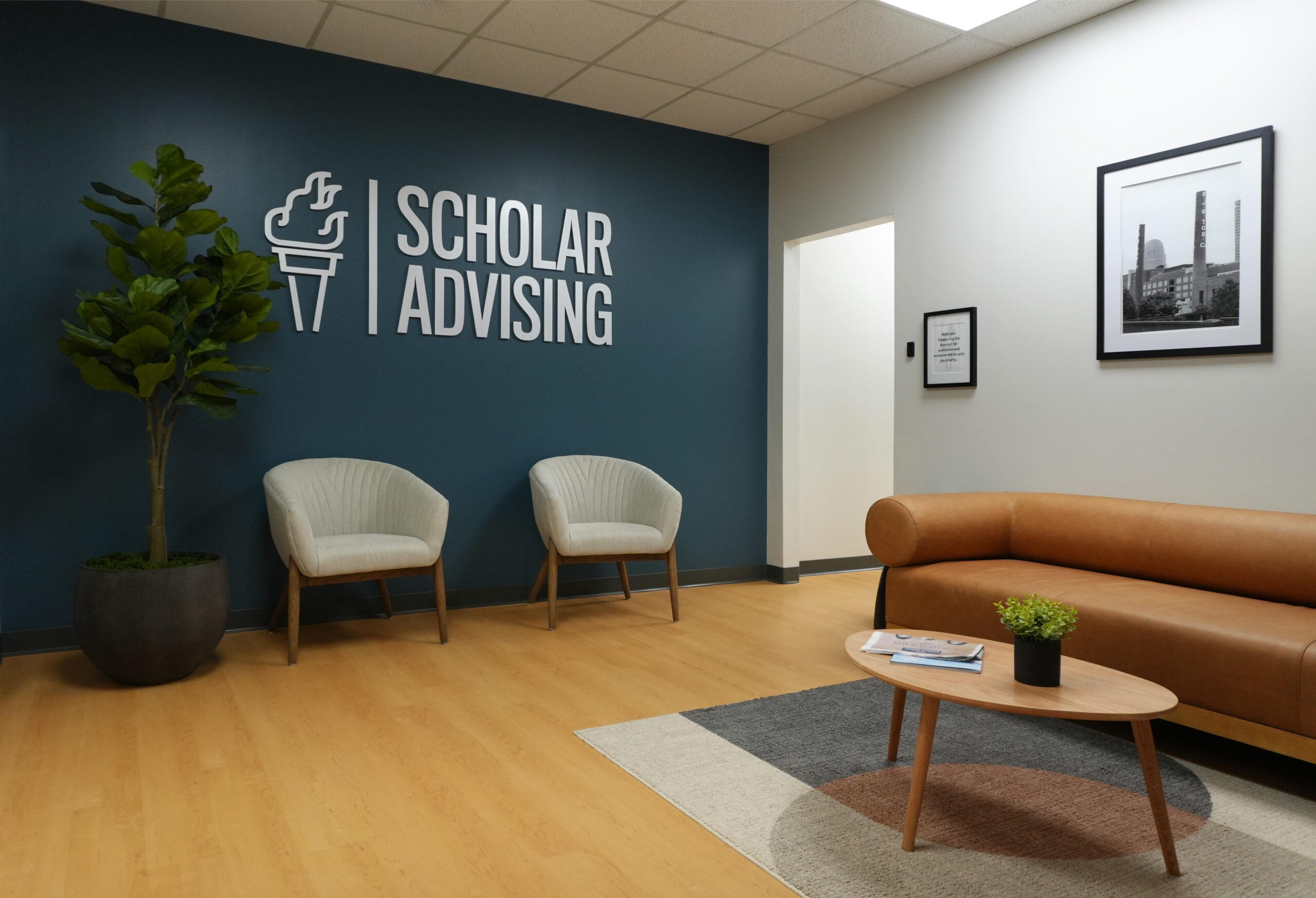 Scholar Advising office lobby with a couch and chairs